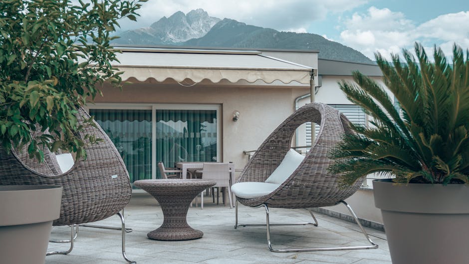 Stylish terrace with lounge chairs and nature view, ideal for relaxation and outdoor living.
